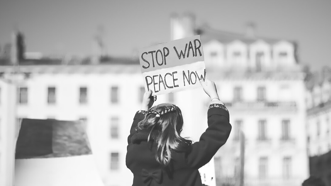 Amidst protests in Lyon against the war in Ukraine, a compelling image emerges: a woman holding a sign that passionately declares 'Stop War, Peace Now,' echoing the fervent calls for peace amidst global unrest