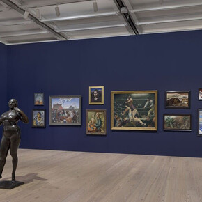 Installation view of The Whitney’s Collection: Selections from 1900 to 1965 (Whitney Museum of American Art, New York, June 28, 2019- ). Left wall: Six photographs by Charles Sheeler, (No title), 1933. Center of room: Gaston Lachaise, Standing Woman, 1912-27. Right wall, left to right, top to bottom: Madeline Shiff, Wiltz at Work, 1932; Anne Goldthwaite, Rebecca, c. 1925; John Steuart Curry, Baptism in Kansas, 1928; John D. Graham, Head of a Woman, 1926; Thomas Hart Benton, The Lord is my Shepherd, 1926; George Bellows, Dempsey and Firpo, 1924; Yasuo Kuniyoshi, Landscape, 1924; Katherine Schmidt, The Snake, 1932; Oscar Bluemner, Last Evening of the Year, c. 1929; Stuart Davis, Early American Landscape, 1925; Rockwell Kent, The Trapper, 1921; George C. Ault, Hudson Street, 1932; Charles Burchfield, Winter Twilight, 1930. Photograph by Ron Amstutz