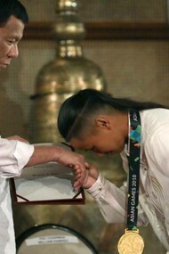 skater Margielyn Didal shows respect to President Rodrigo Roa Duterte at Malacañan Palace, Manila, Philippines, 2018