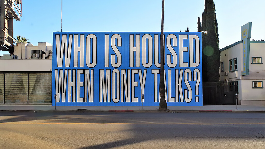 Barbara Kruger’s mural on the housing crisis poses a striking question—‘Who is housed when money talks?’—highlighting inequality in access to shelter
