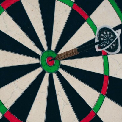 Darts aimed to hit the bull's eye