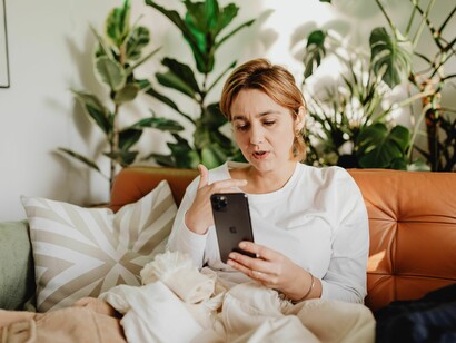 Shocked, a girl watching a hilarious meme flash across her screen