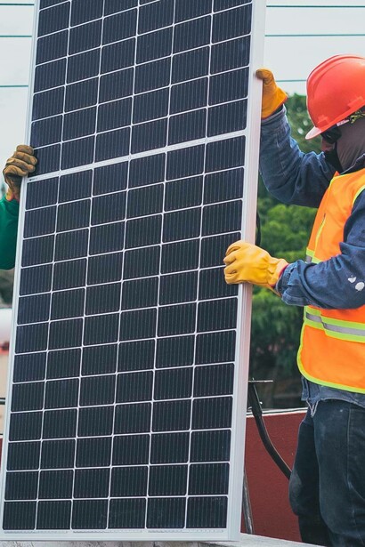 Man holds a solar panel