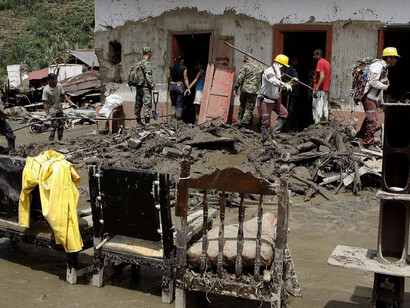 Colombian mudslide town counts cost as rescuers search for missing