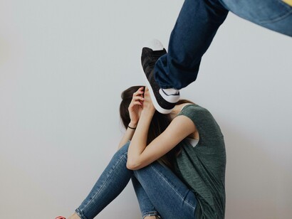 A man abusing his partner as she attempted to break free from him