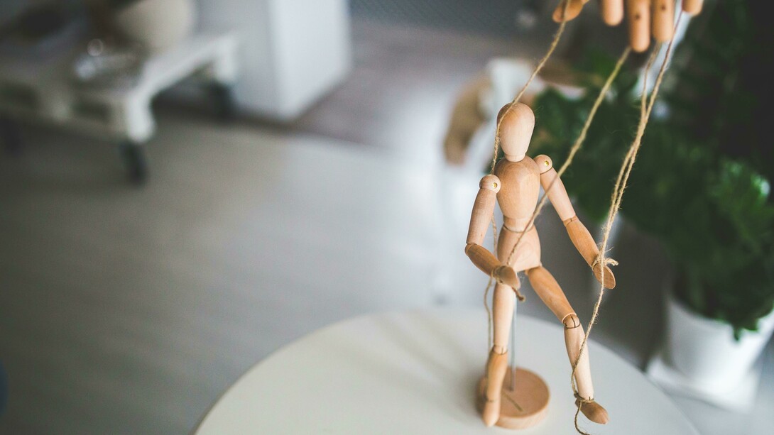 A marionete being displayed to represent how theatre influences our way of living