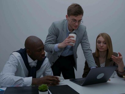 A trio of young business students putting the final touches on their pitch to investors