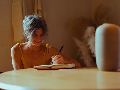 As she writes in her notebook, each word is a step towards transforming her scattered thoughts into a clearer, more cohesive narrative
