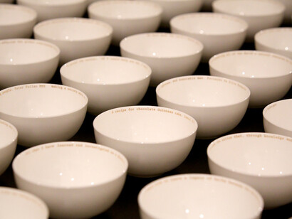 Claire Twomey, Everyman’s Dream, 2013, bone china and 18 carat gold text. Installation view, Legacy at Crafts Council fair Collect at Saatchi Gallery © Sophie Mutevelian