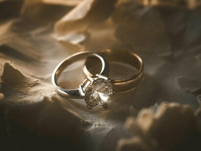 A ring set against a muted background, representing how marriage can be formed by both personal and societal pressures