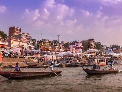As the sun rose, the facades of temples and buildings that lined the ghats reflected the first rays of light, Varanasi, India