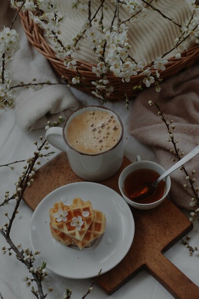 Coffee, waffles and some syrup 