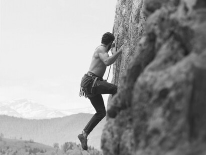 This image of a determined climber mirrors Roberto Espeche's own unwavering spirit as he navigated life's obstacles
