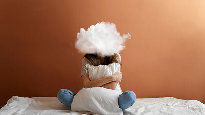 A woman poses with a cloud-shaped head, symbolizing the weight of anxiety while practicing stress management and coping with overwhelming news intake