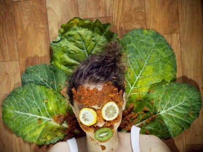 Inge, surrounded by vegetables and fruit