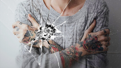 A background featuring a cracked glass effect with a woman expressing depression, anger issues