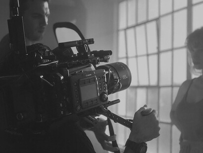 Amidst the bustling movie set, the dedicated cameraman focused on the intricate movie recording, ensuring every frame was captured flawlessly