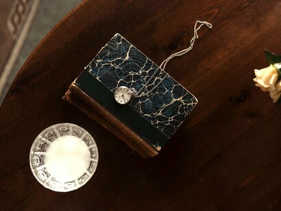 Ancient book with clock