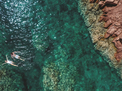 This enchanting vista of Isola Rossa, Sardinia, perfectly captures the untouched beauty and timeless allure of the Costa Rossa region, Italy
