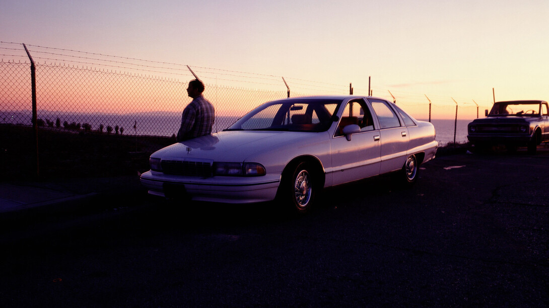 Jason Rhoades with the Caprice overlooking Los Angeles International Airport, 1996. © The Estate of Jason Rhoades. Courtesy the Estate of Jason Rhoades and Hauser & Wirth