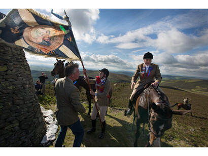 Jeremy Sutton-Hibbert, Royal Burgh Standard Bearer Martin Rodgerson and his Burleymen attendants, Three Brethren cairns summit, during the Common Riding festivities in Selkirk, Scotland, 2013 from the series Unsullied and Untarnished © Jeremy Sutton-Hibbert/Document Scotland