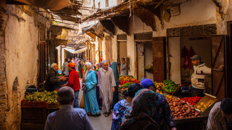 At Essaouira's market, the aroma of traditional delicacies mingles with the essence of shared history, embodying Morocco's legacy of openness and acceptance