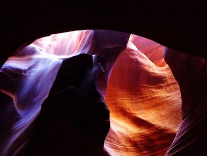 In Sedona, Arizona, USA, the vortexes of light reflecting through the wind-shaped rocks add an enchanting and mystical touch to this captivating natural wonder