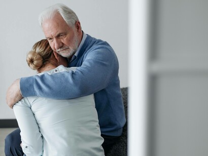 A loved one being consoled after going through a near-death experience