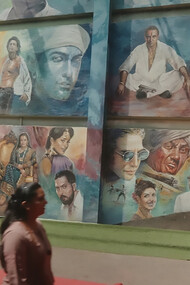 A picture from Film City, Mumbai showing a mural featuring various Bollywood actors and characters, India
