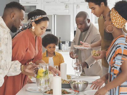 
The family collaboratively prepares a meal, creating a warm and bustling atmosphere in the kitchen as they work together to craft a delightful culinary experience