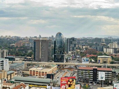 A panoramic view of Nairobi’s modern skyline rising above busy urban roads, representing Kenya’s status as East Africa’s economic hub
