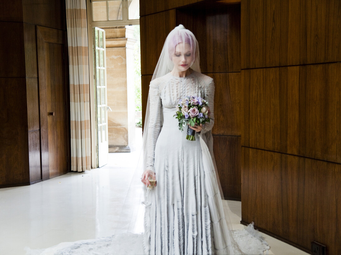 Pale grey slashed chiffon wedding dress  designed by Gareth Pugh and veil by Stephen Jones, 2011. Courtesy of Katie Shillingford. Photo © Amy Gwatkin