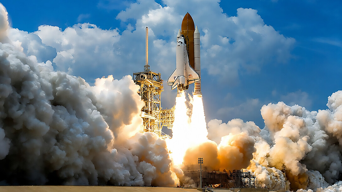 At NASA’s Kennedy Space Center in Florida, space shuttle Atlantis launches through clouds of smoke and steam on its STS-125 mission to service the Hubble Space Telescope. The 11-day mission included five spacewalks to upgrade Hubble with advanced scientific instruments and extend its operational life