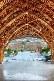 A bamboo structure with layered arches and joints, showing the fusion of traditional knowledge and modern engineering