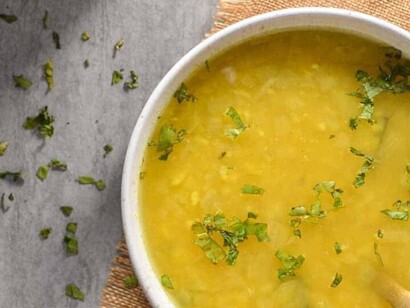 A bowl of yellow dal Indian lentil soup. Lentils are the most sought-after ingredient for their gluten-free quality and vegan versatility