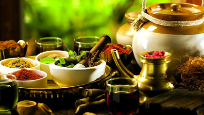 A serene display of Ayurvedic spices and a traditional teapot, evoking natural healing and balance