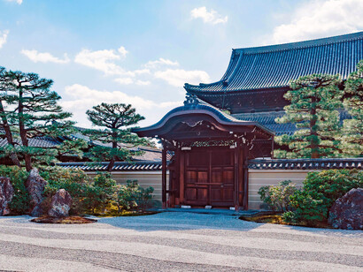 In Kyoto, a serene Japanese Zen garden surrounding a traditional temple creates an atmosphere of stillness, balance, and quiet contemplation