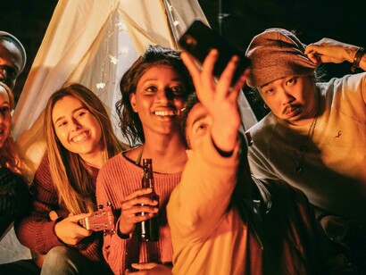 Friends posing for a selfie, representing the joy of capturing the moment as it is