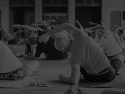 A group of people exercise and stretching together