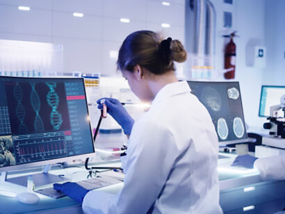 In a state-of-the-art laboratory, a female doctor collaborates with a multi-ethnic research team to study DNA mutations