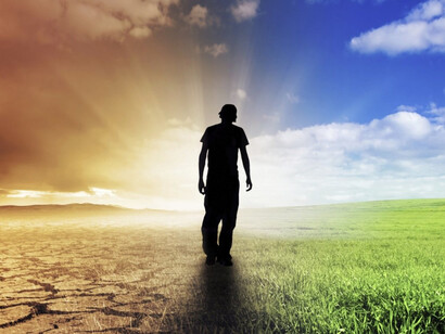 A man walking the middle line between pessimism and optimism