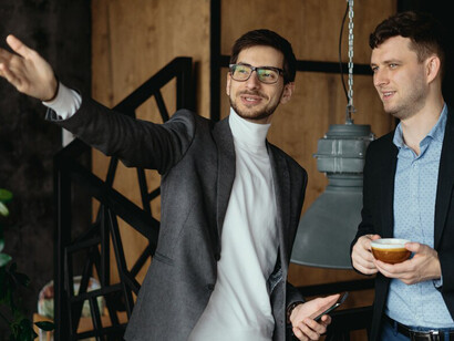 Business men conversation, pointing hand to the window