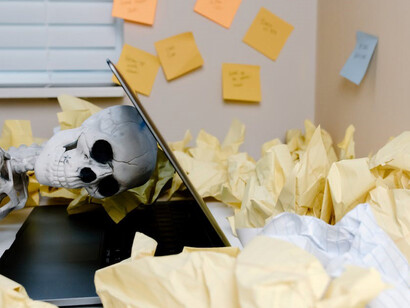 A frail skeleton, engulfed by the unforgiving sea of work-related pressure