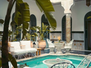 White and blue swimming pool inside a traditional riad in Marrakesh, Marrakesh–Safi, Morocco