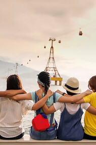 A group of people holding shoulders sitting on wall
