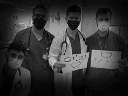 Jewish and Arab medical staff at Haifa’s Rambam Health Care Campus offer a message of solidarity