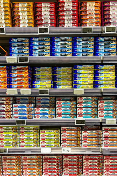 Brightly packaged canned seafood products displayed in a vibrant supermarket aisle, capturing everyday grocery shopping in France, Le Touquet, Hauts-de-France, France
