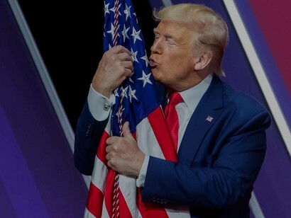 President Donal Trump is affectionate with the American flag in his non-Liberal Order fashion