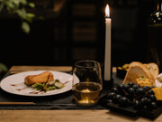 In the midst of chaos and uncertainty, a candlelit dinner offers a comforting reminder that, despite the world's troubles, simple pleasures still abound