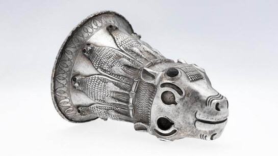 Silver calf’s head drinking vessel with lapis lazuli horn buds. Assyria, northern Mesopotamia. 7th century BCE. 19 x 13.3 cm. The al-Sabah Collection, Dar al-Athar al-Islamiyyah, Kuwait. 
